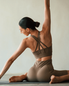 Woman practicing yoga in a minimalistic setting