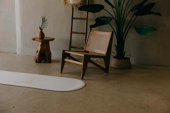 Wooden chair and table with plants in a minimalistic room
